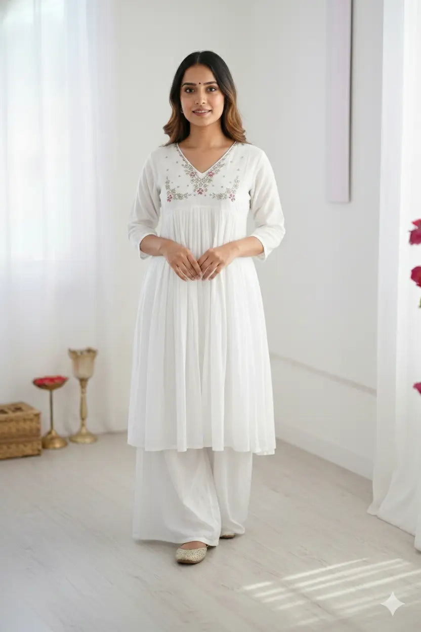 Women's elegant white pleated kurta with bead work detailing