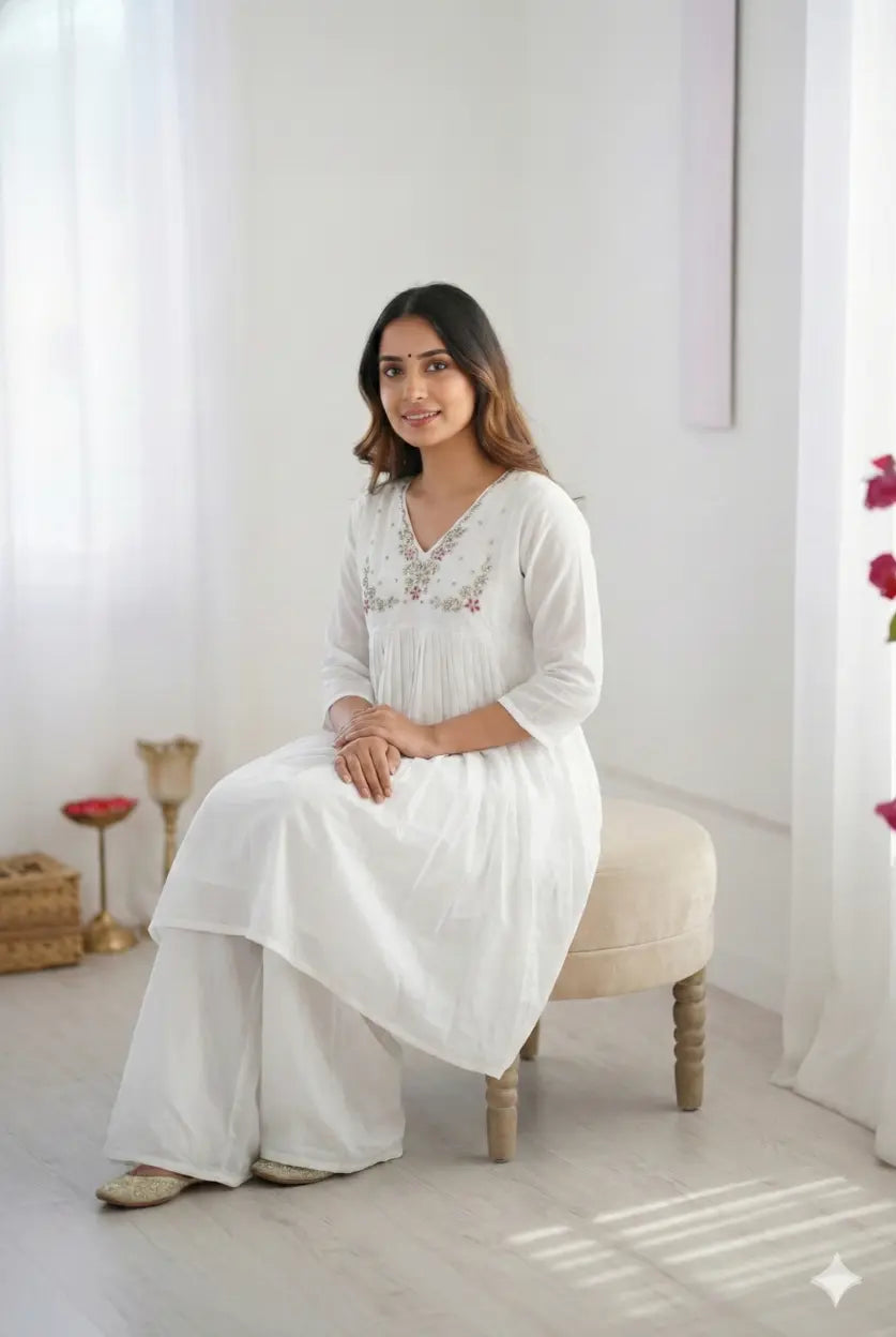 Women's elegant white pleated kurta with bead work detailing