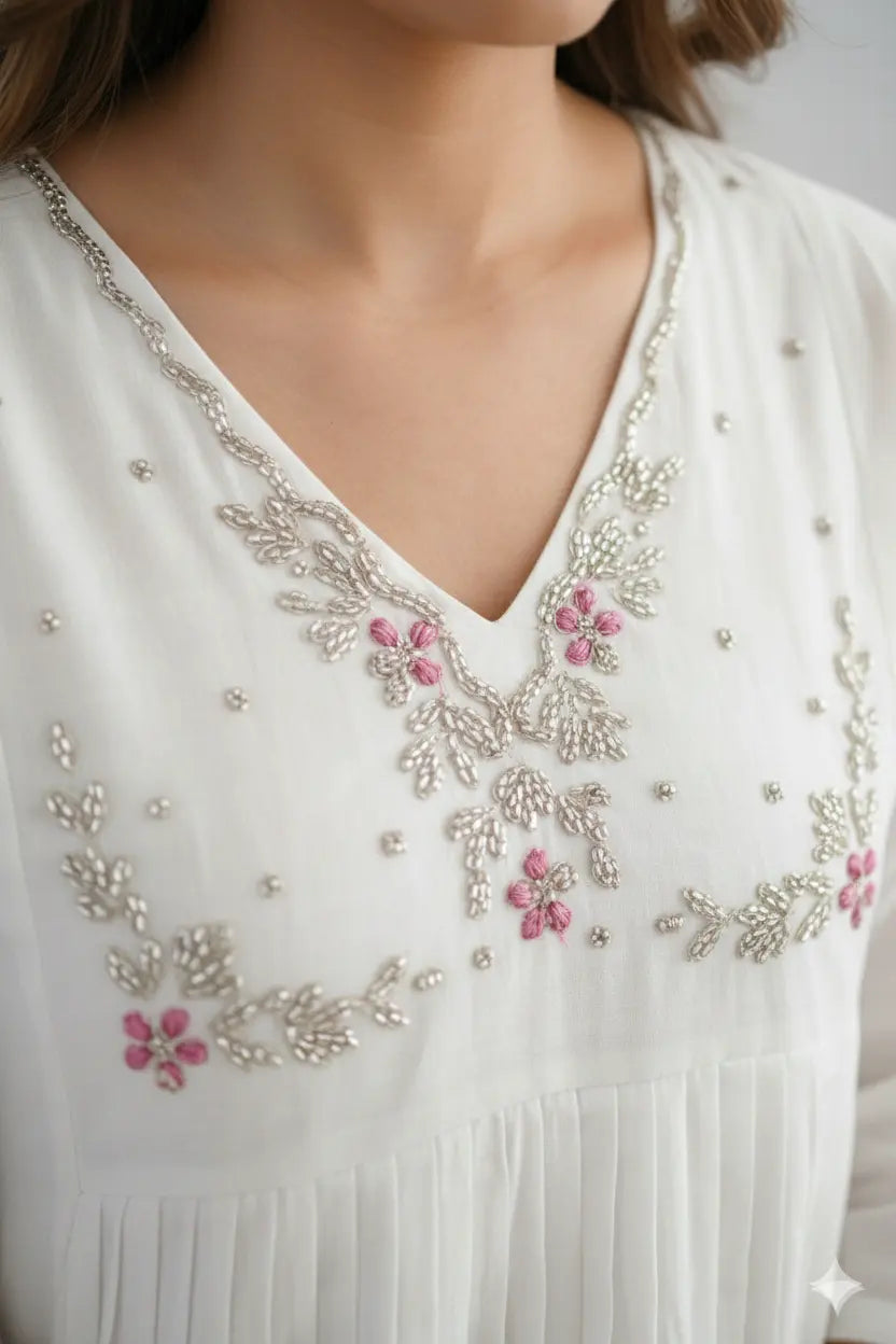 Women's elegant white pleated kurta with bead work detailing